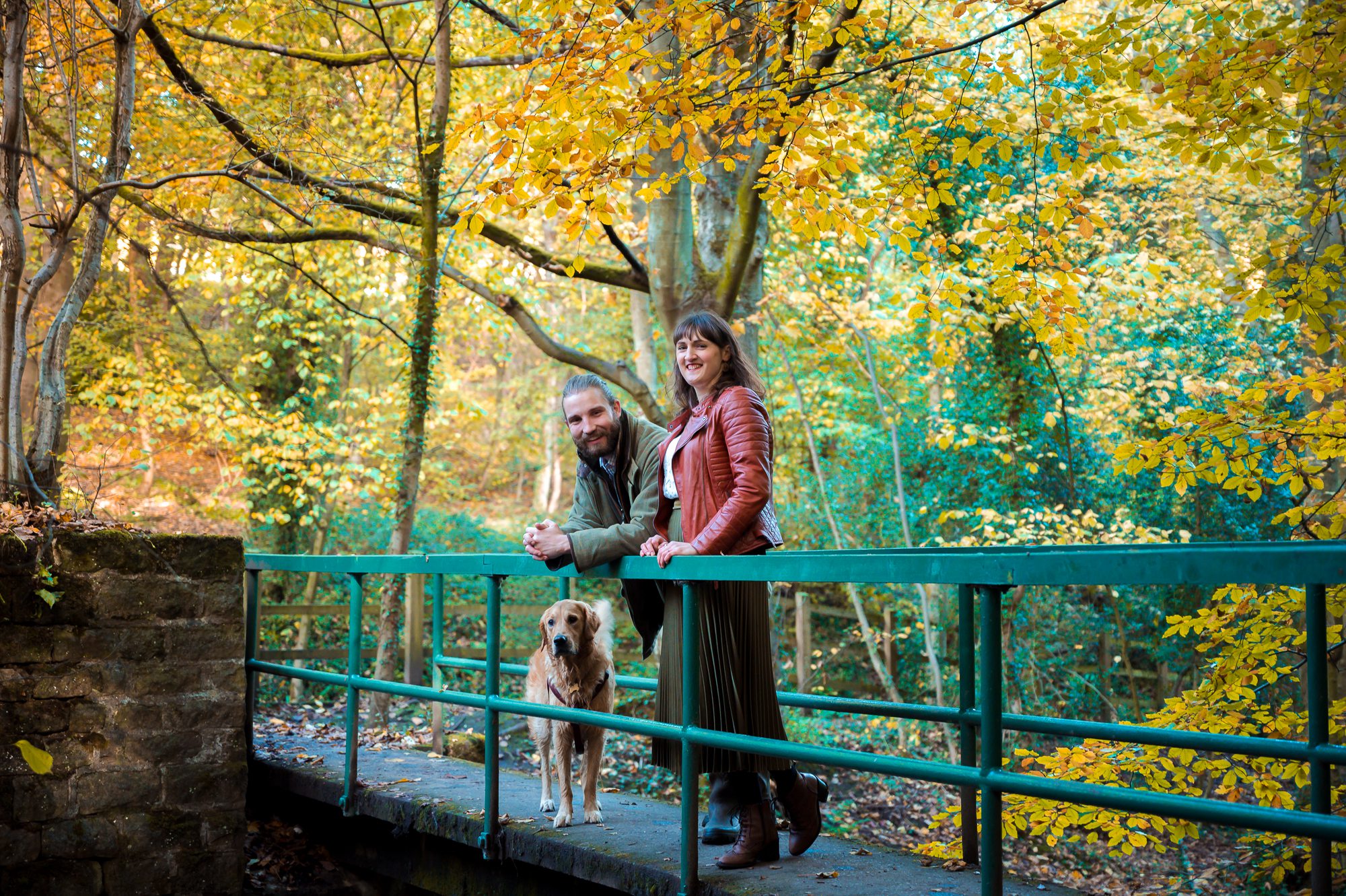 photo of couple posing on the green metal bridge at The Rivelin Valley trail