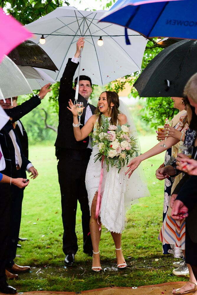 Confetti photograph with umbrellas Tadcaster Rustic Yurt Wedding, Rustic Yurt Wedding Photos, Tadcaster Wedding Photographer