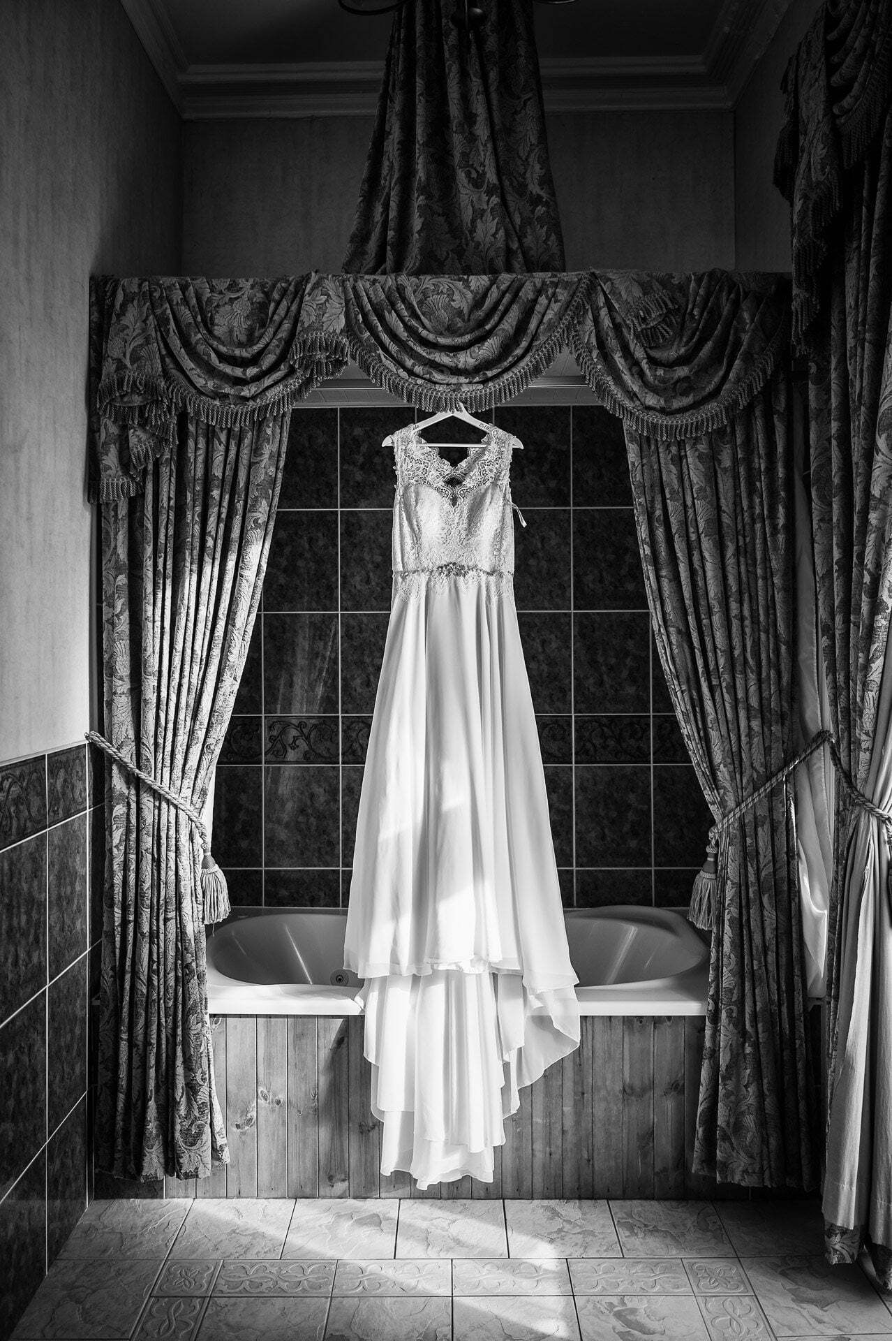 Wedding dress hanging up in bathroom at Walworth Castle Hotel,Darlington ,Walworth Castle Hotel Photographer, Walworth Wedding Photos