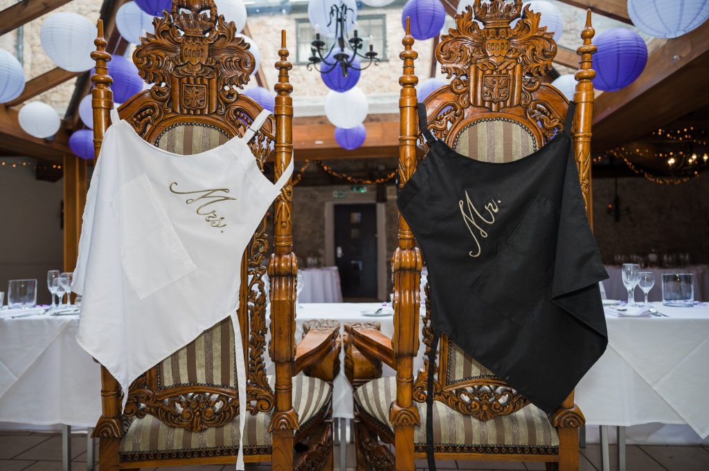 image of bride and groom chairs inside