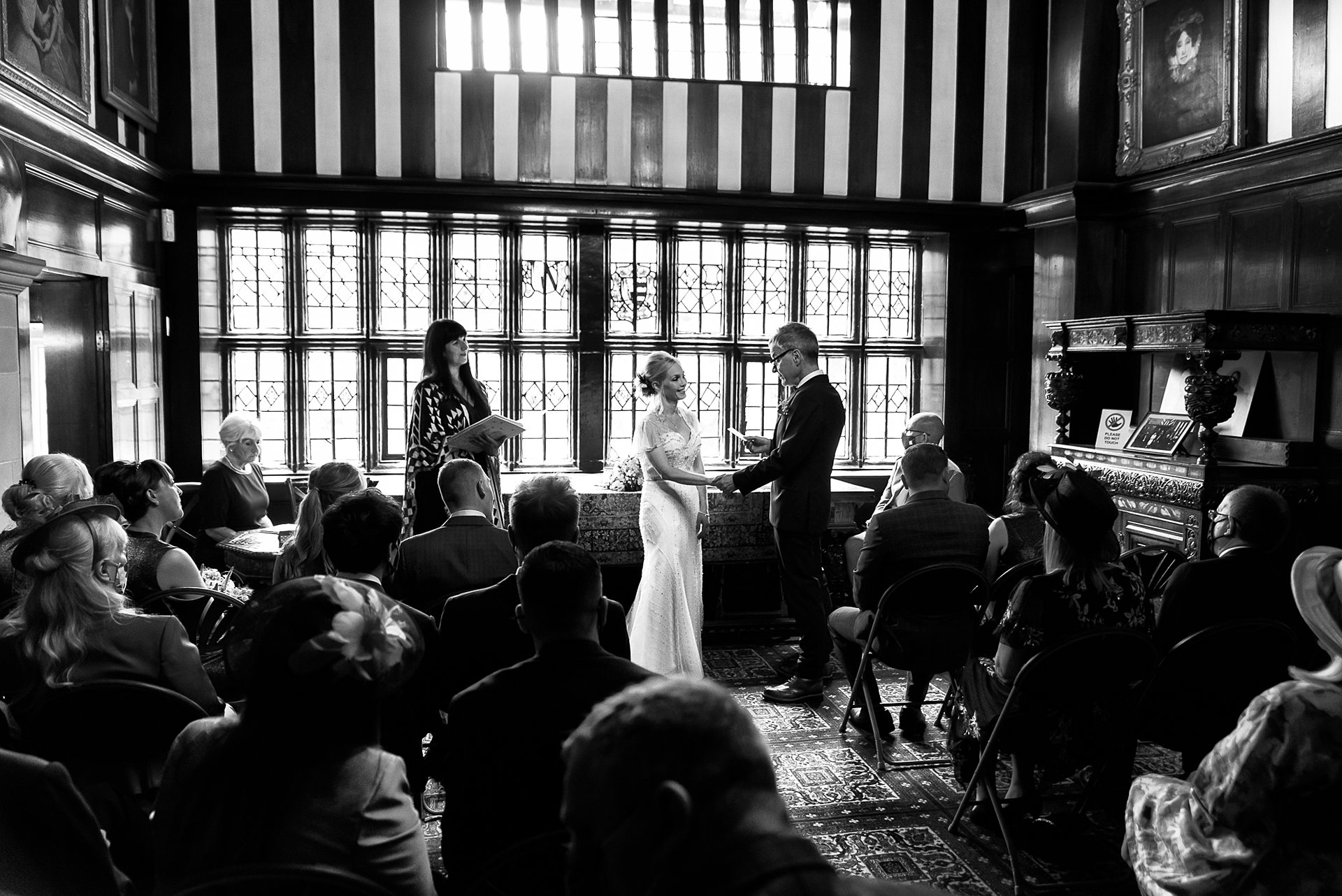 picture of a wedding taking place inside shibden Hall