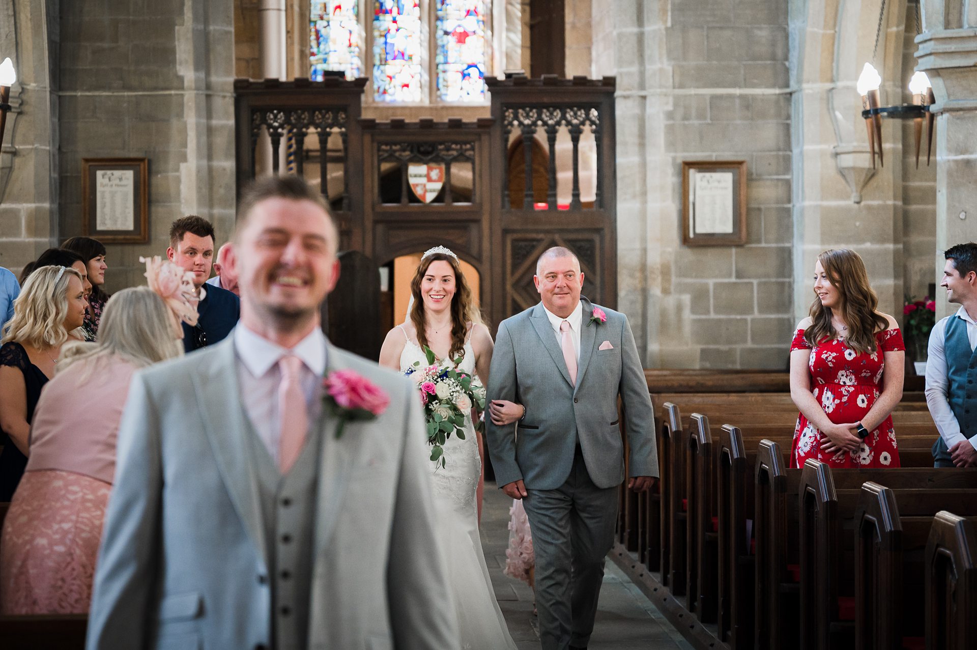 photo of bride walking down the isle inside the church, St Michael And Our Lady,