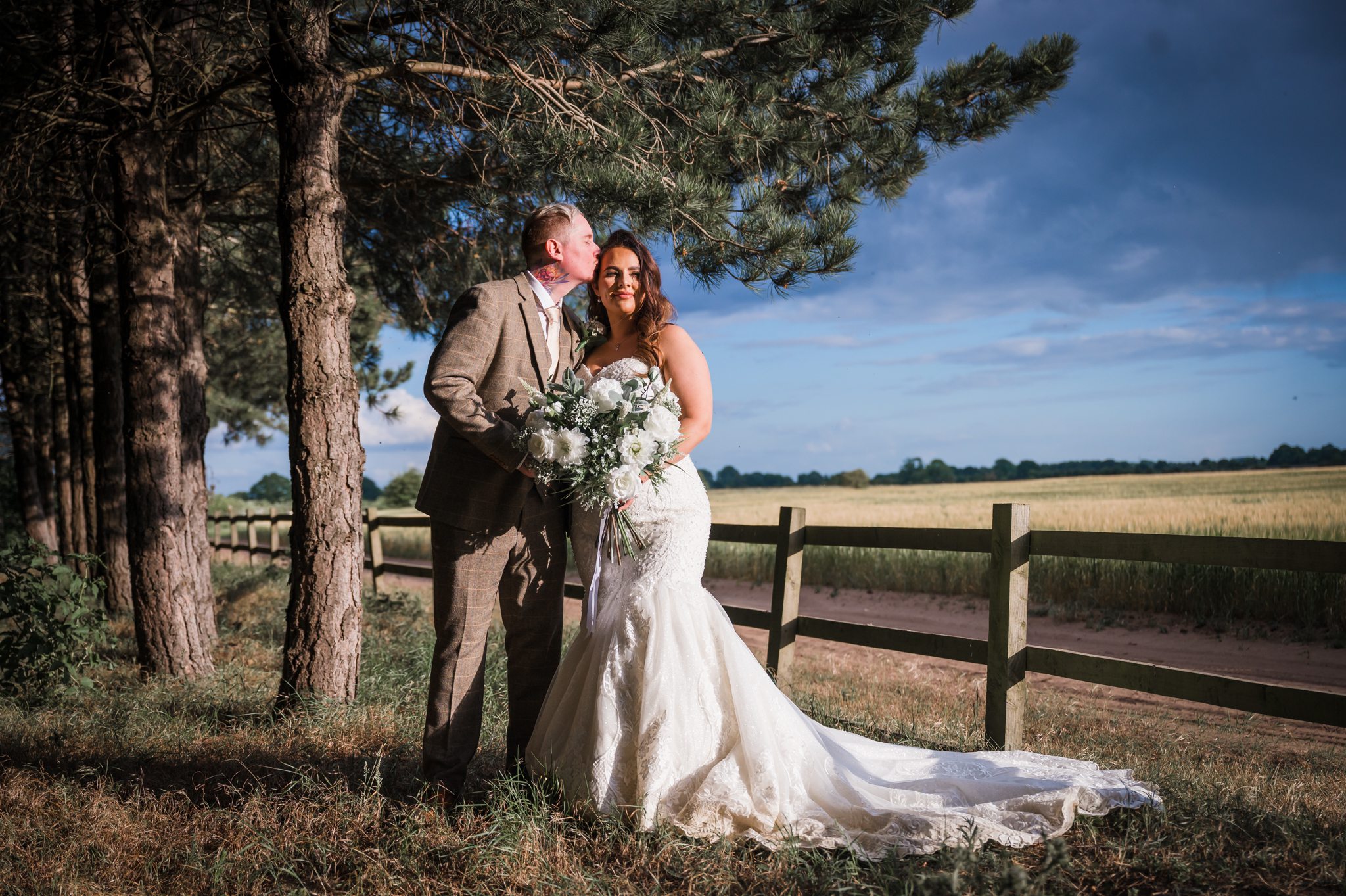 bride and groom pose in the woodland at bunny hill farm