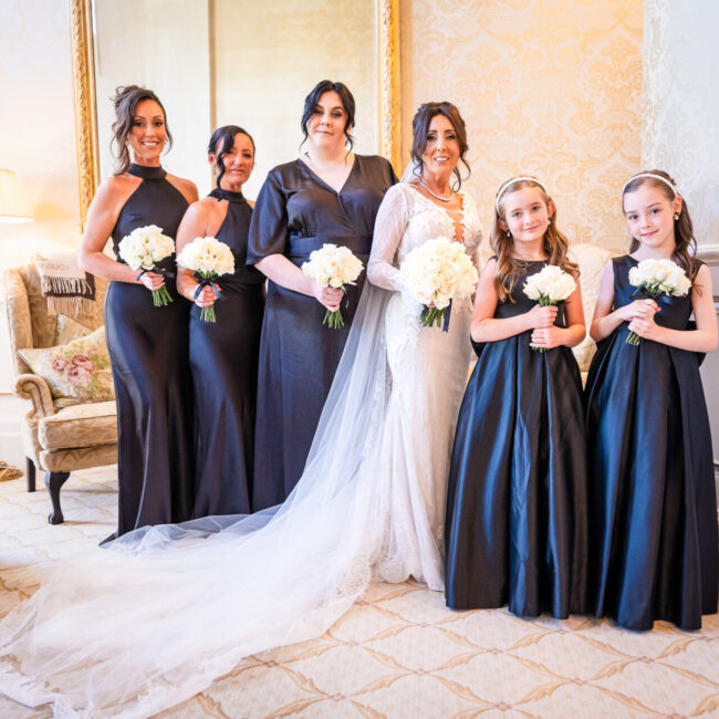 The whole bridal party posing for a picture just before the ceremony in the Royal suite at Grantley Hall