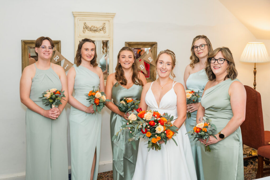 bride with her bridesmaids in the getting ready room, Holdsworth House