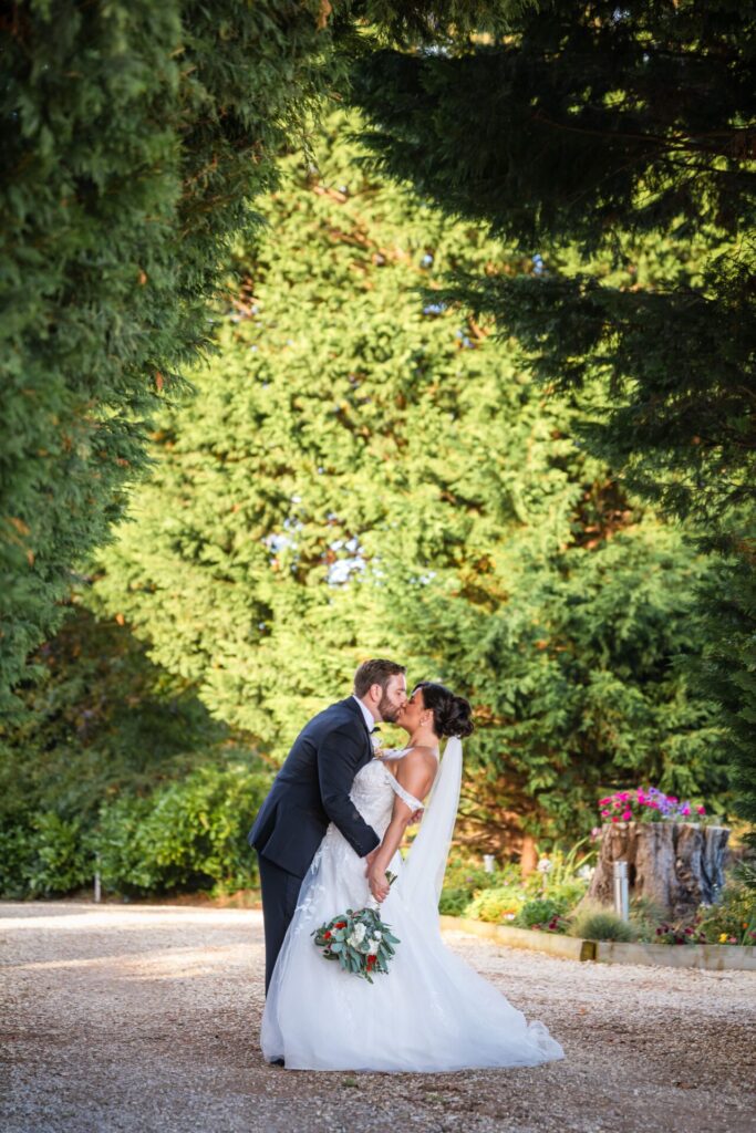 Bride & groom kiss at Woodstock Weddings, romantic autumn bridal portrait.